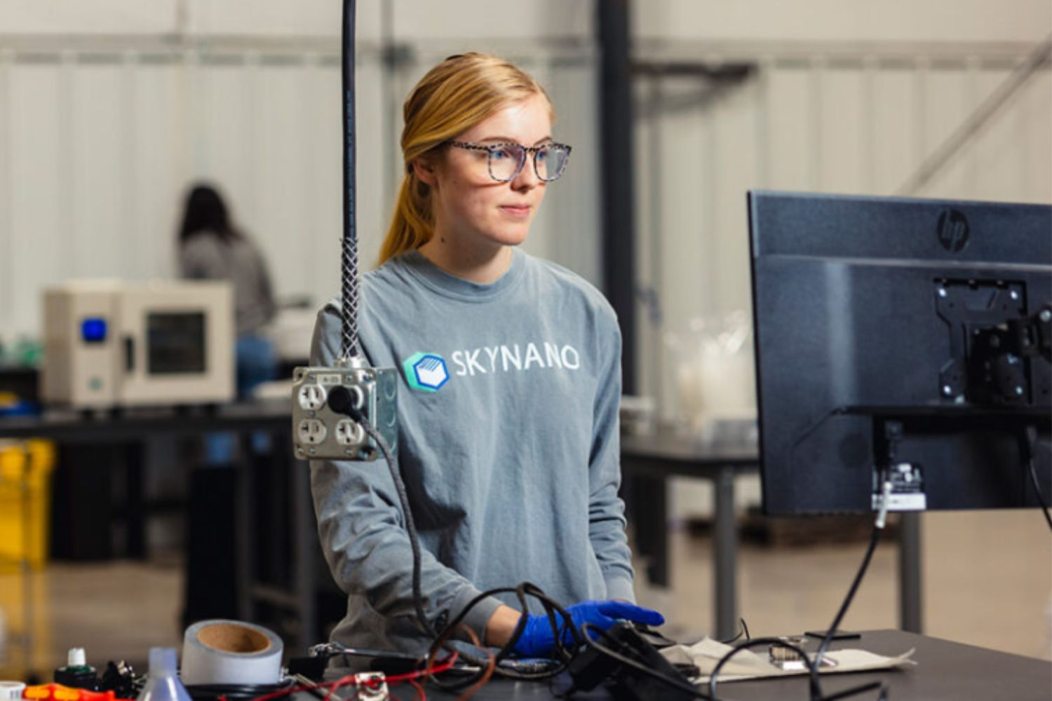 One woman doing work on computer in lab