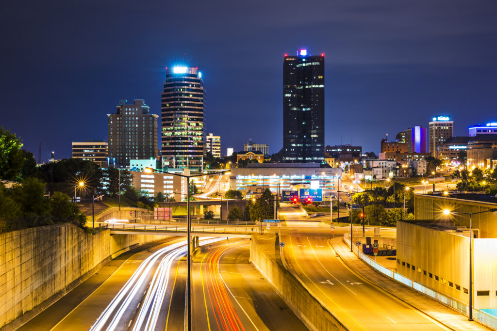 4 Men Looking Enthusiastically at Science Equipment